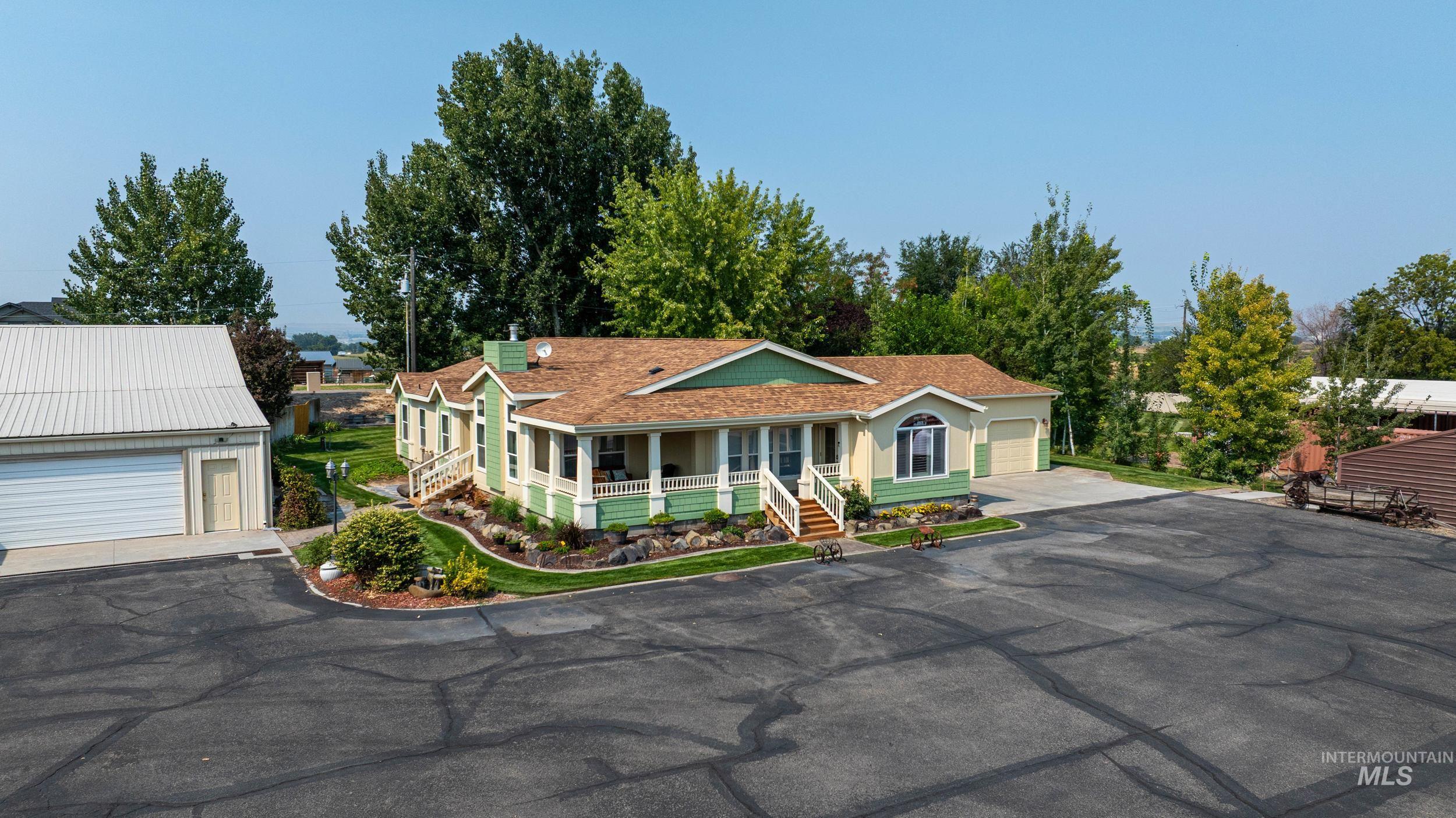 28279 Pearl Road Parma, ID 83660 - Photo 24 of 48 View of front of house featuring covered porch and a garage