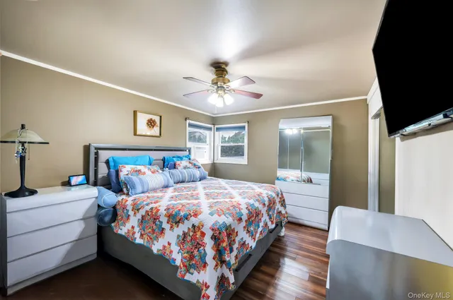 a bedroom with bed and a chandelier