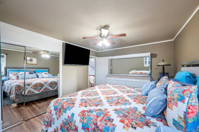 a bedroom with two beds and a window