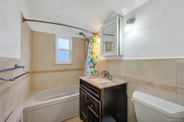 a bathroom with a sink a toilet and a bathtub