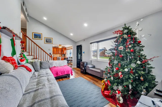 a living room with furniture and flowers