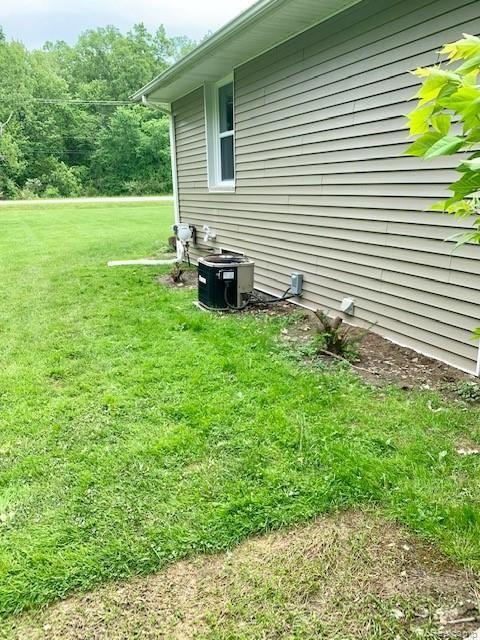 5254 Van Slyke Road Flint, MI 48507 - Photo 44 of 44 Side of home and central air unit