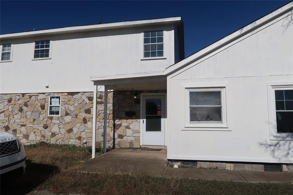 406 North Denny Street, Unit B Howe, TX 75459 - Photo 1 of 12 a front view of a house with a garage