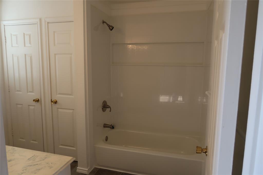 406 North Denny Street, Unit B Howe, TX 75459 - Photo 7 of 12 a bathroom with a bathtub