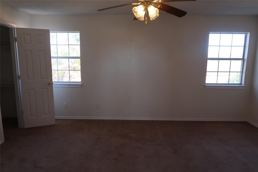 406 North Denny Street, Unit B Howe, TX 75459 - Photo 8 of 12 an empty room with windows