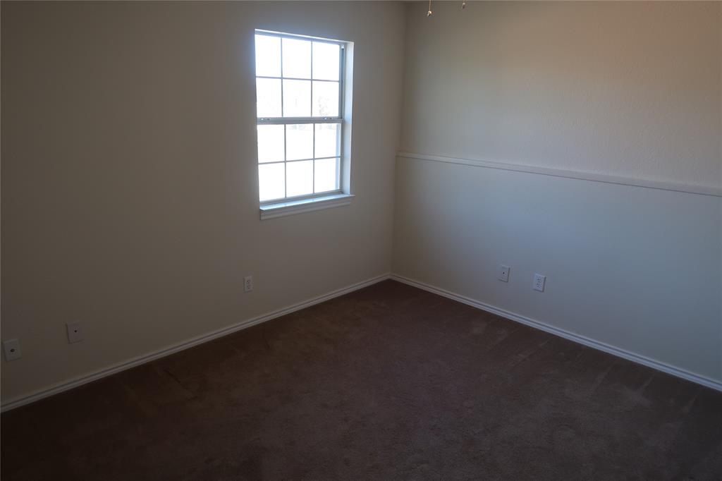 406 North Denny Street, Unit B Howe, TX 75459 - Photo 9 of 12 an empty room with a window