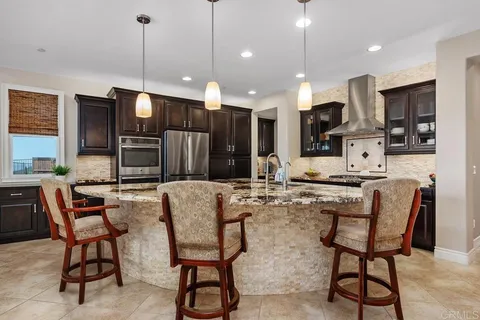 a kitchen with a sink and stove