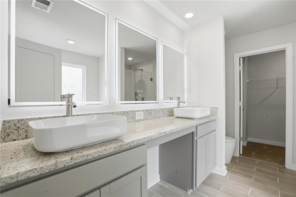 5351 Tolar Road South Fulton, GA 30213 - Photo 12 of 30 a bathroom with a granite countertop sink and a mirror