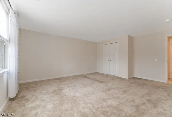a view of a balcony with wooden floor
