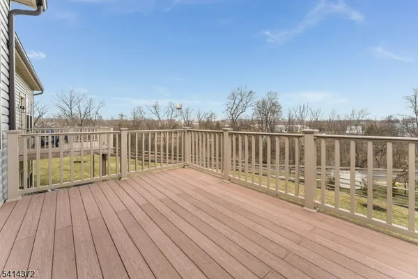 a view of a balcony with wooden floor