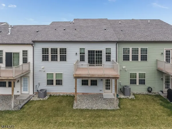 a front view of a house with a yard table and chairs