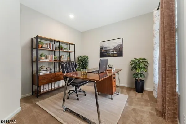 a workspace with furniture and a potted plant