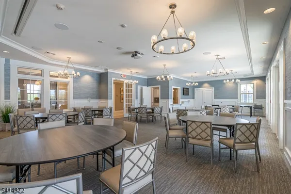 an aerial view of residential houses with outdoor space and river