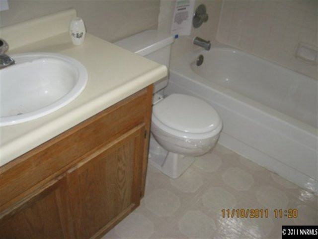 4985 West 7th Street, Unit 12 Reno, NV 89503 - Photo 4 of 6 a bathroom with a sink a toilet and bathtub