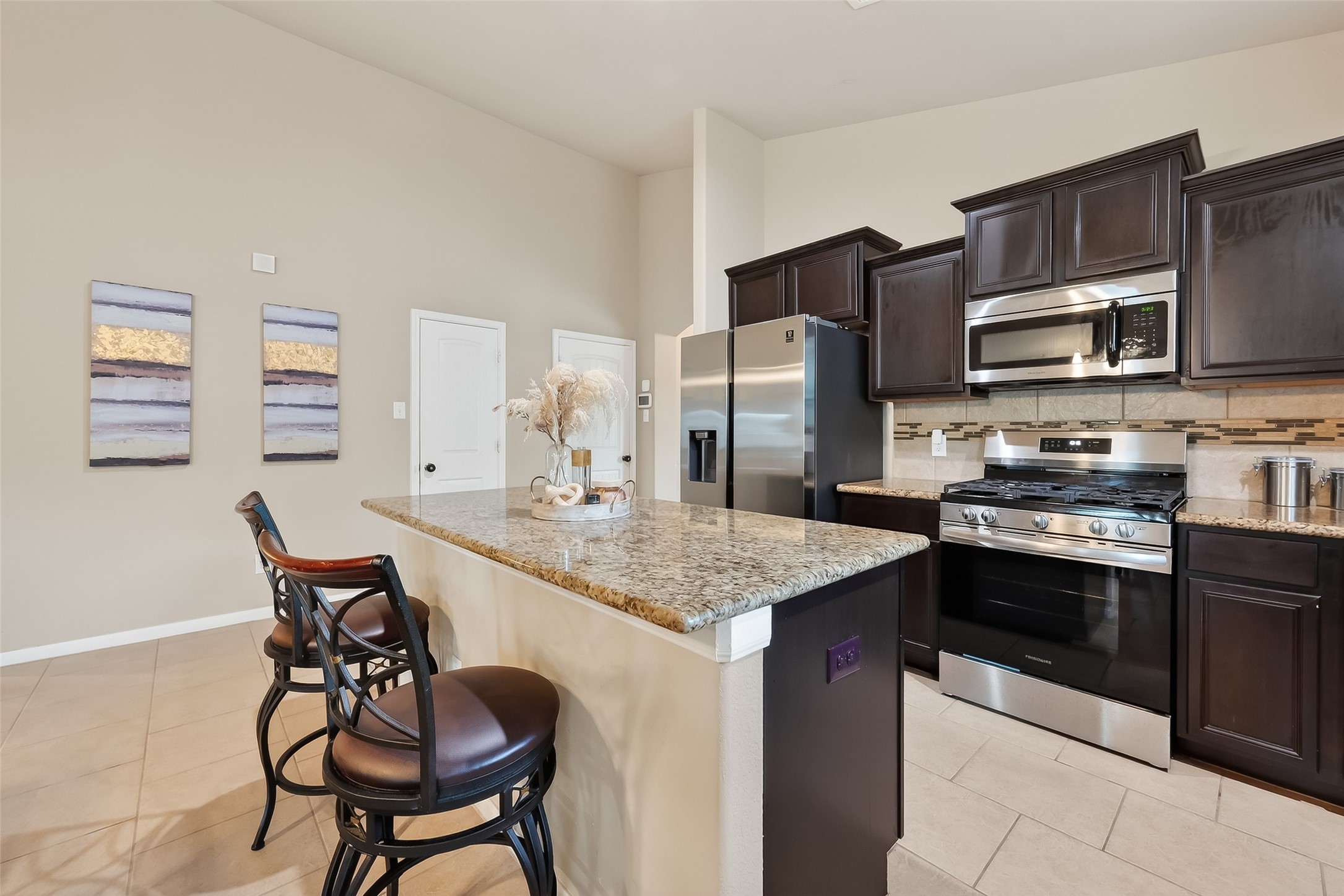 5919 Micah Lane Rosenberg, TX 77471 - Photo 13 of 32 Spacious kitchen with a large island that offers extra seating and a comfortable spot for everyday use