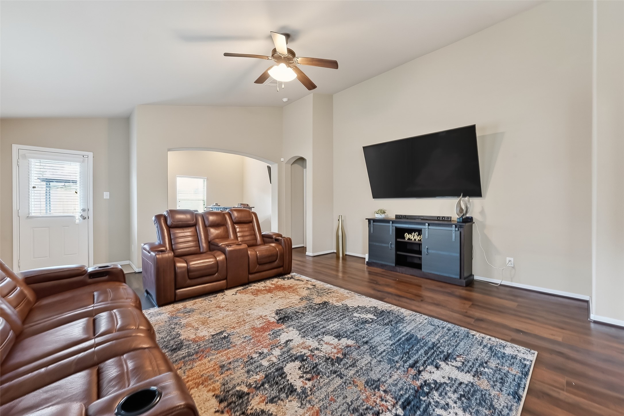 5919 Micah Lane Rosenberg, TX 77471 - Photo 16 of 32 Spacious living area with high ceilings and well-placed windows, creating a bright and relaxed setting that feels open and inviting