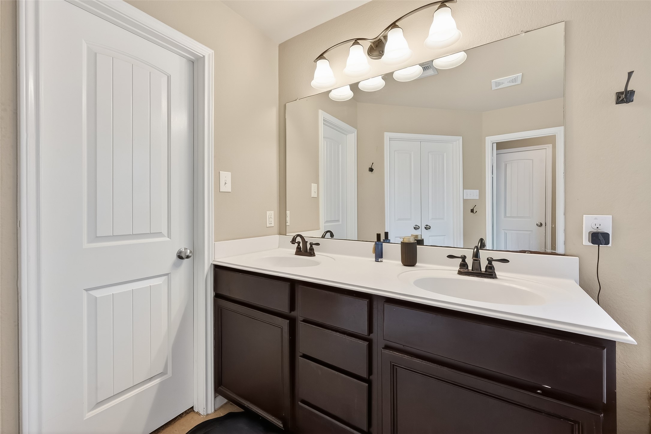 5919 Micah Lane Rosenberg, TX 77471 - Photo 25 of 32 Bathroom with double sinks and ample storage, offering plenty of space for everyday essentials