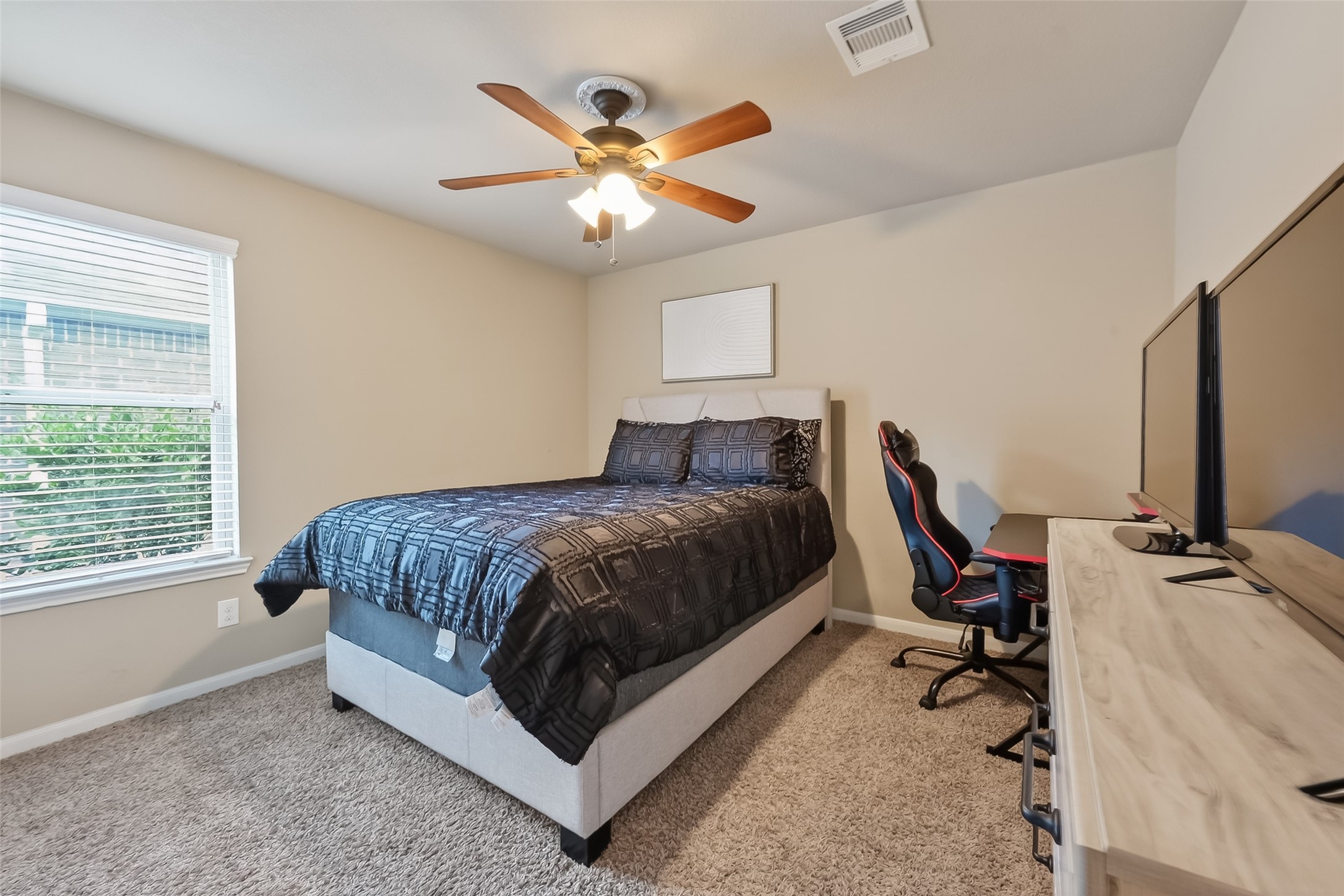 5919 Micah Lane Rosenberg, TX 77471 - Photo 26 of 32 A spacious bedroom with lots of natural light, perfect for relaxation