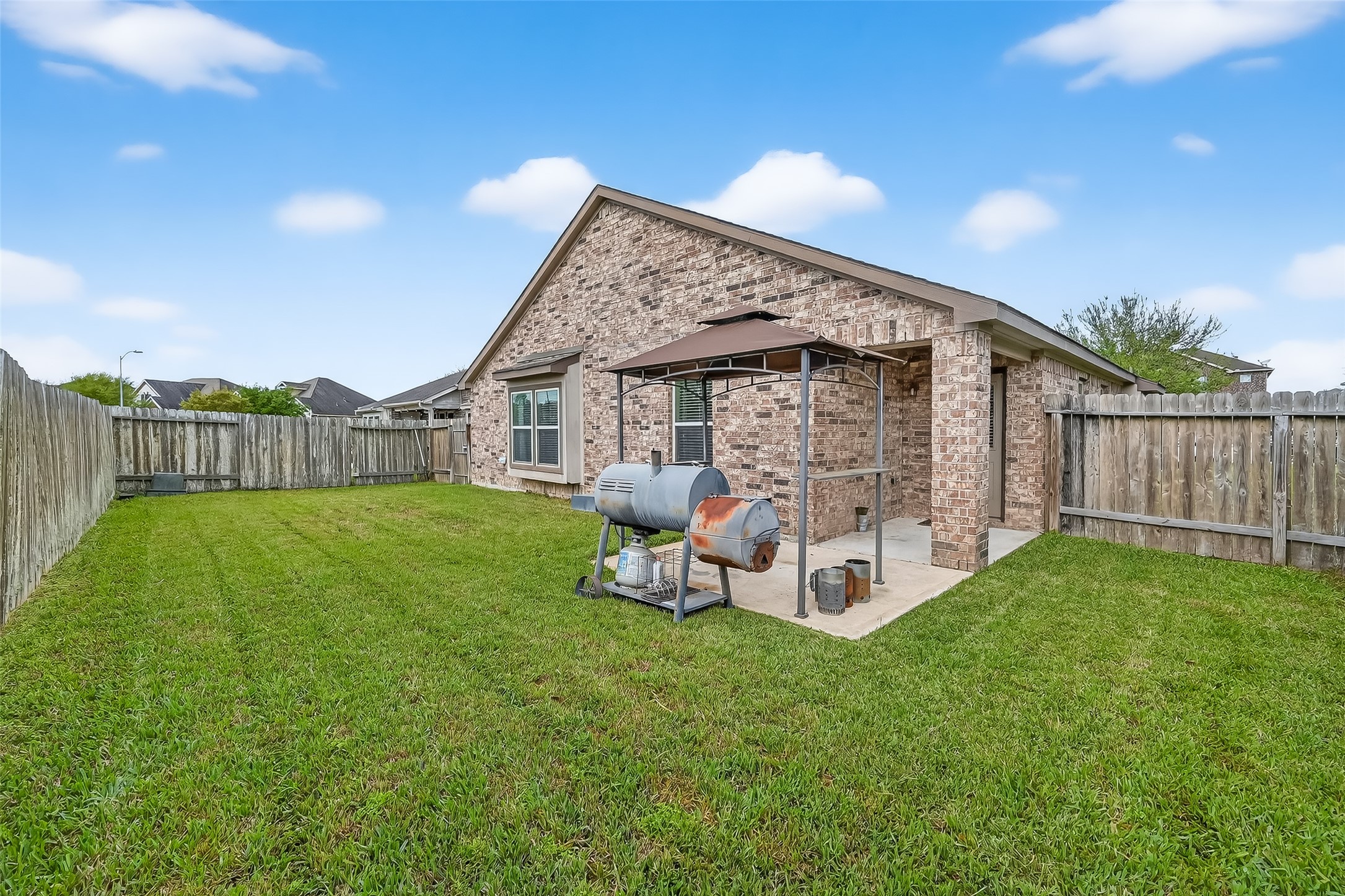 5919 Micah Lane Rosenberg, TX 77471 - Photo 32 of 32 Fully fenced backyard with flourishing green space, creating a serene outdoor retreat