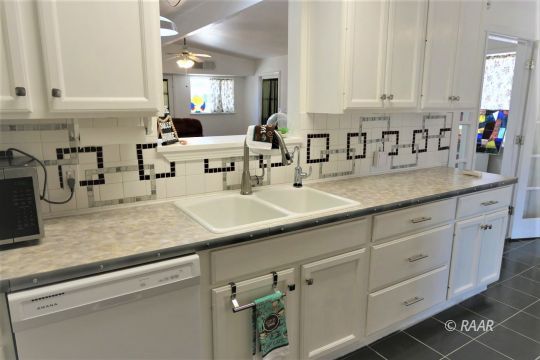 1263 Primrose Street Ridgecrest, CA 93555 - Photo 12 of 35 a kitchen with sink and cabinets