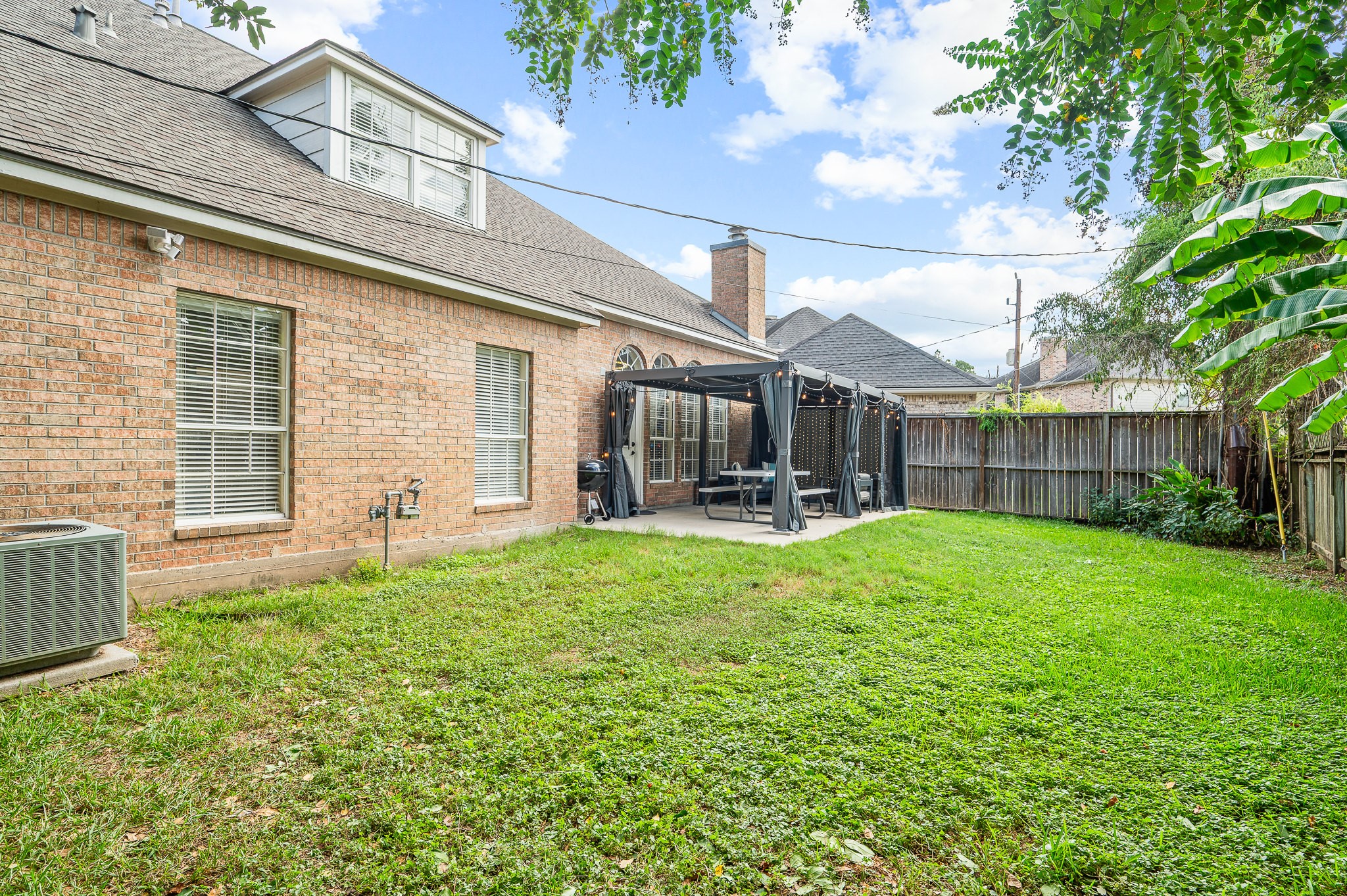 8111 Morningbrook Court Spring, TX 77379 - Photo 44 of 46 a view of a house with backyard and porch