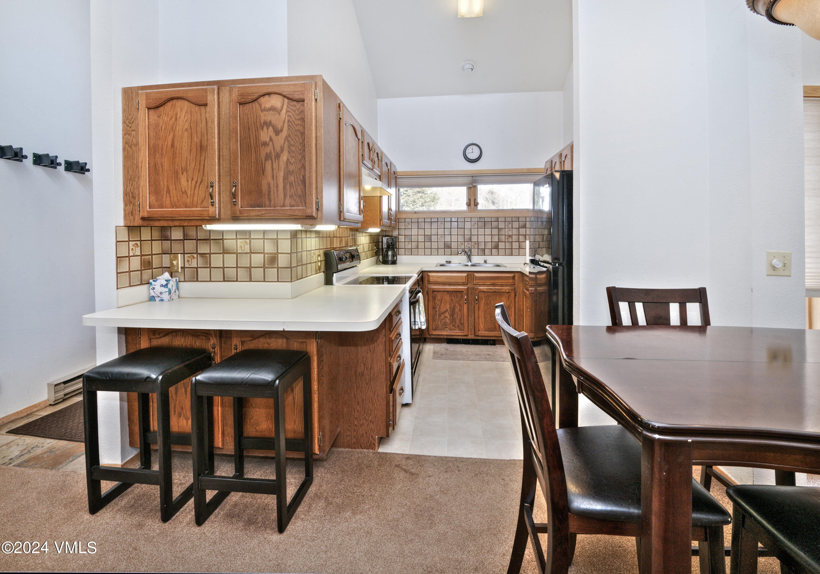 1030 Lions Ridge Loop, Unit 301 Vail, CO 81657 - Photo 11 of 28 a dining room with furniture and window