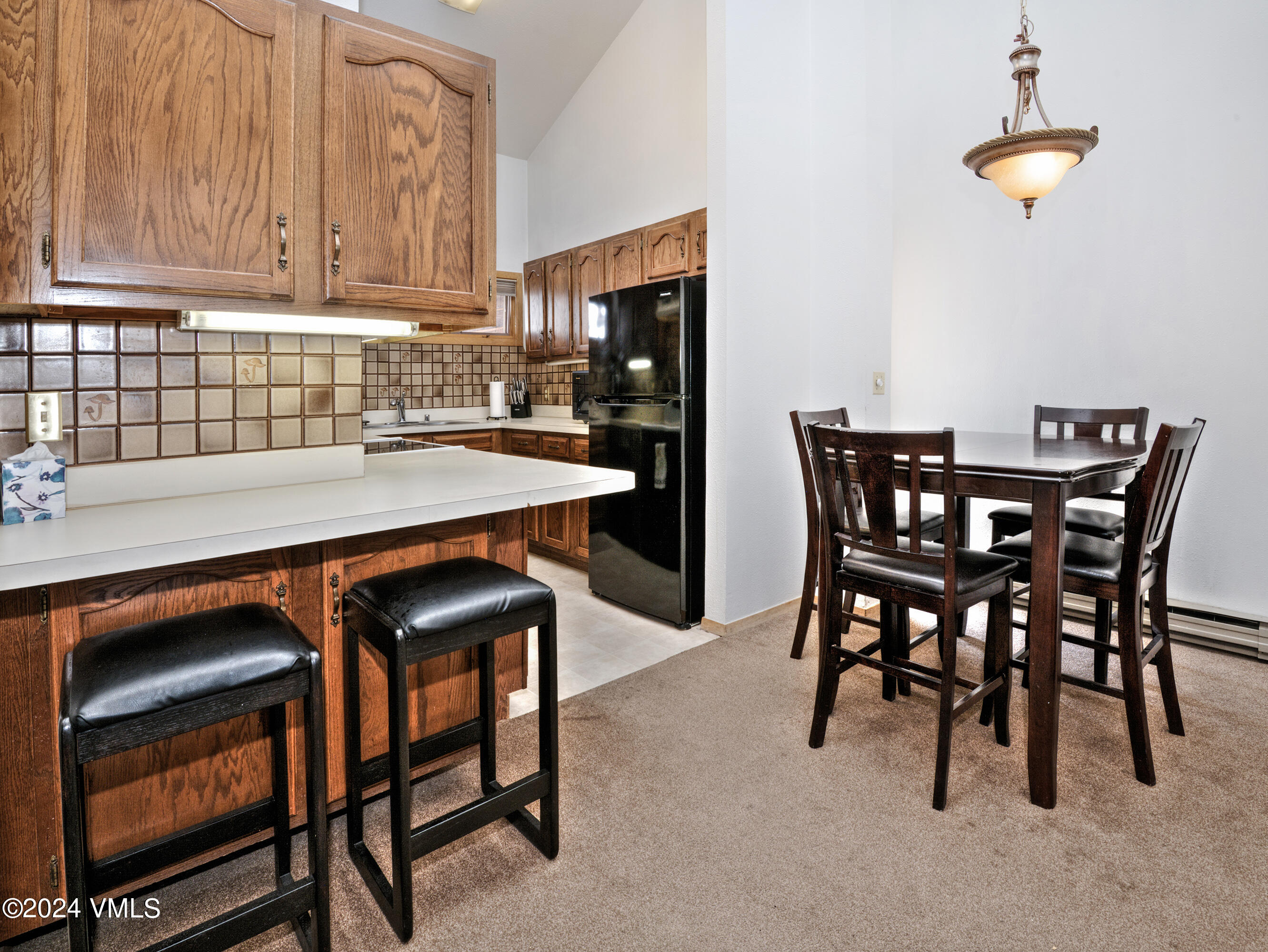 1030 Lions Ridge Loop, Unit 301 Vail, CO 81657 - Photo 12 of 28 a view of a dining room with furniture