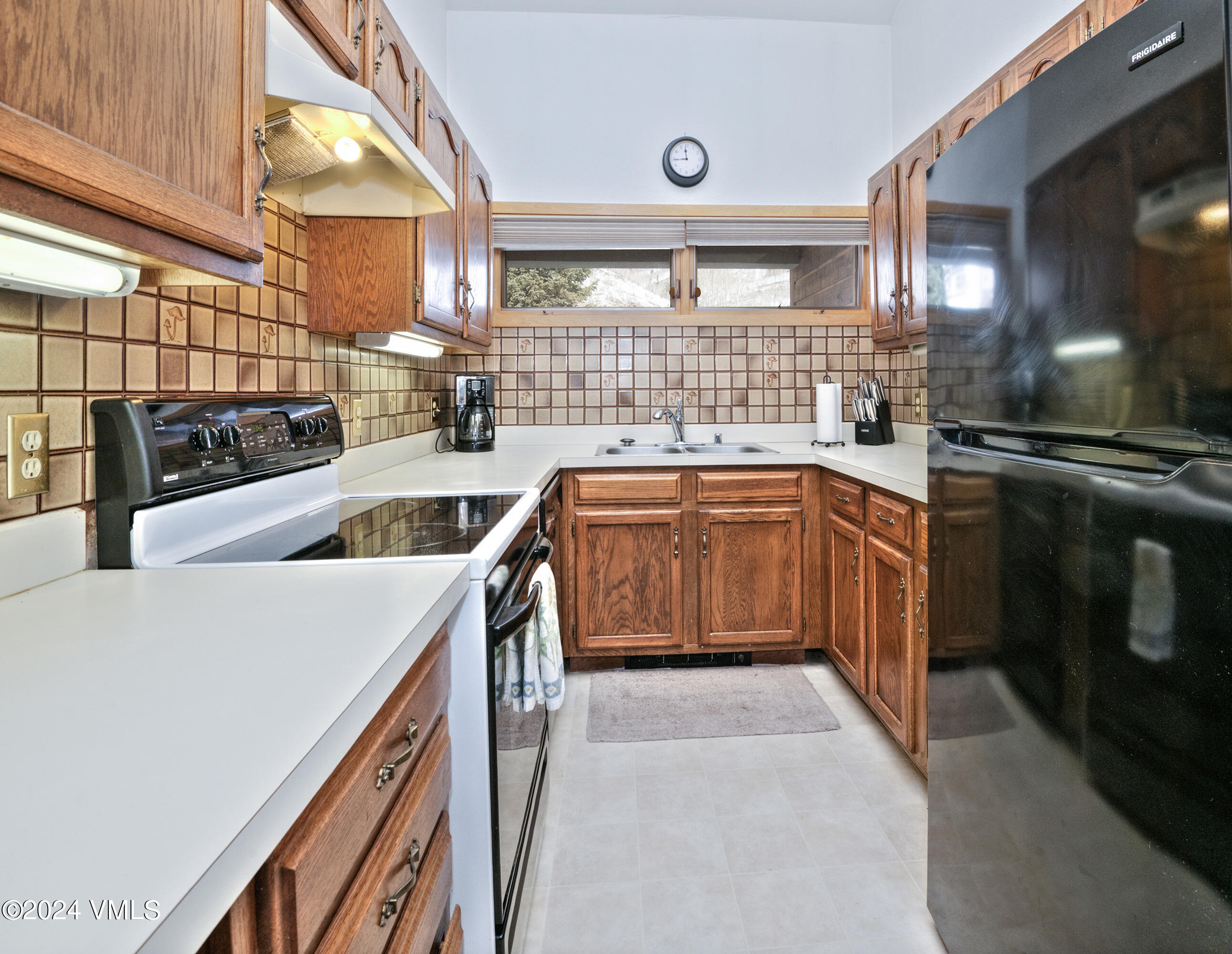 1030 Lions Ridge Loop, Unit 301 Vail, CO 81657 - Photo 13 of 28 a kitchen that has a sink and a stove