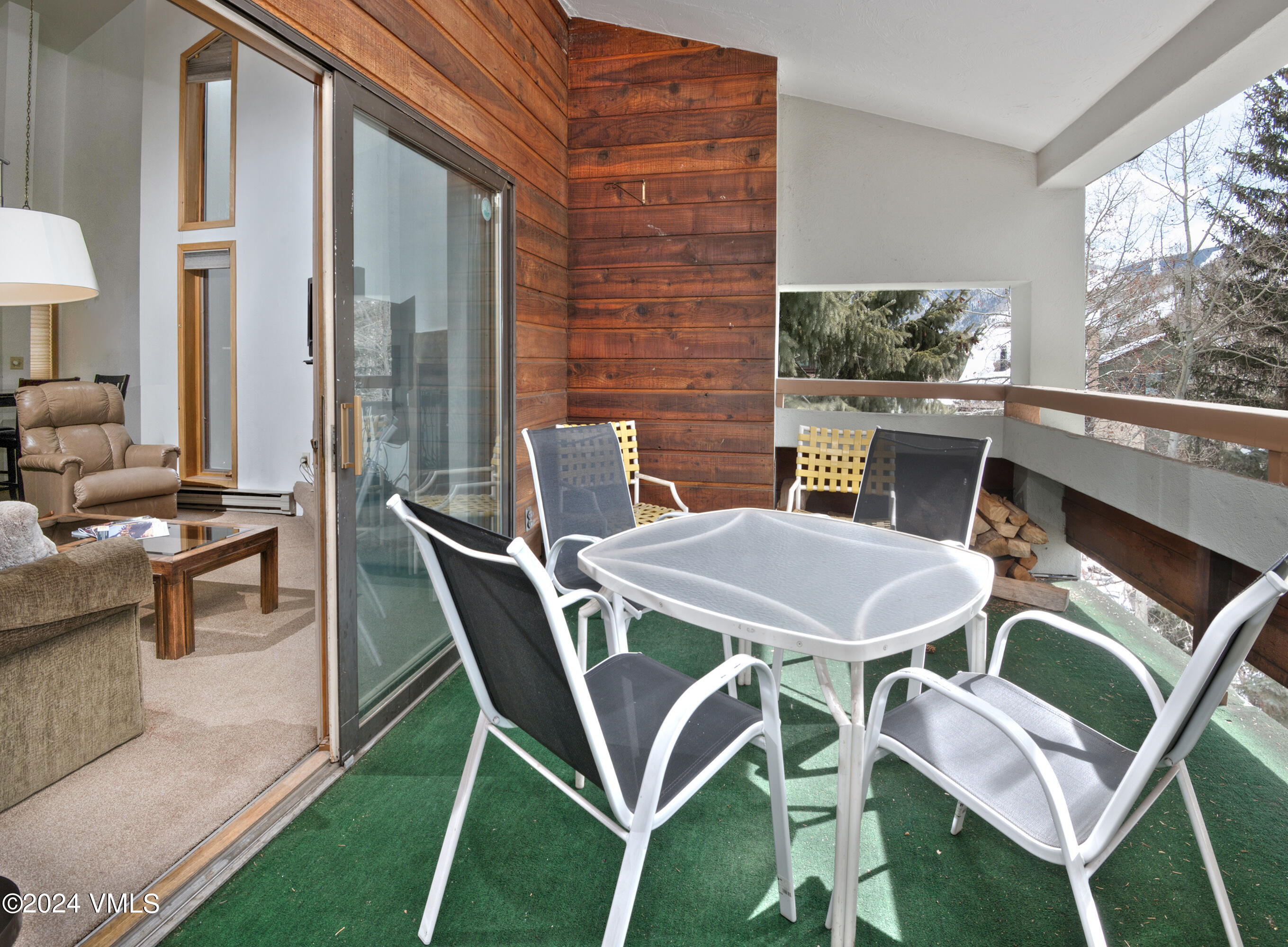 1030 Lions Ridge Loop, Unit 301 Vail, CO 81657 - Photo 15 of 28 a patio with table and chairs