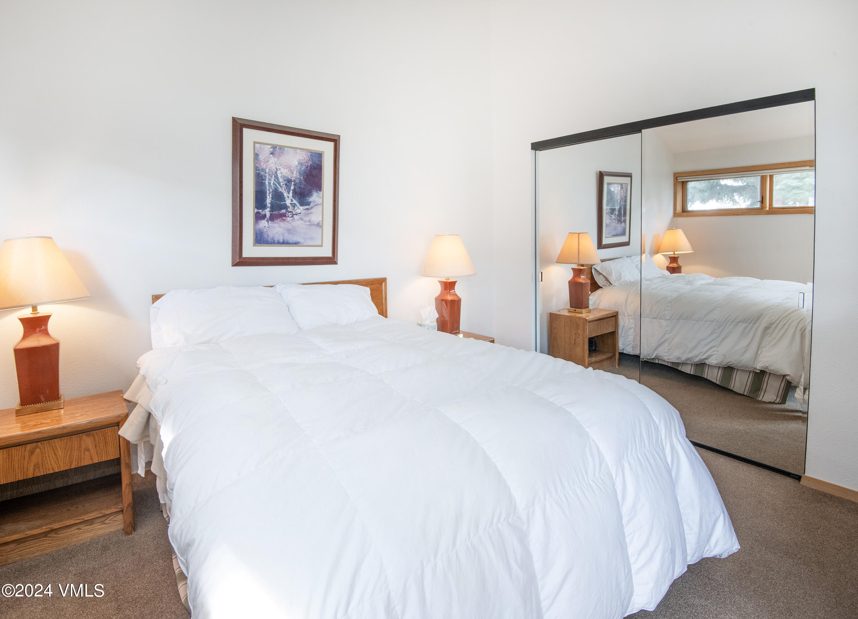 1030 Lions Ridge Loop, Unit 301 Vail, CO 81657 - Photo 17 of 28 a spacious bedroom with two bed and a couch