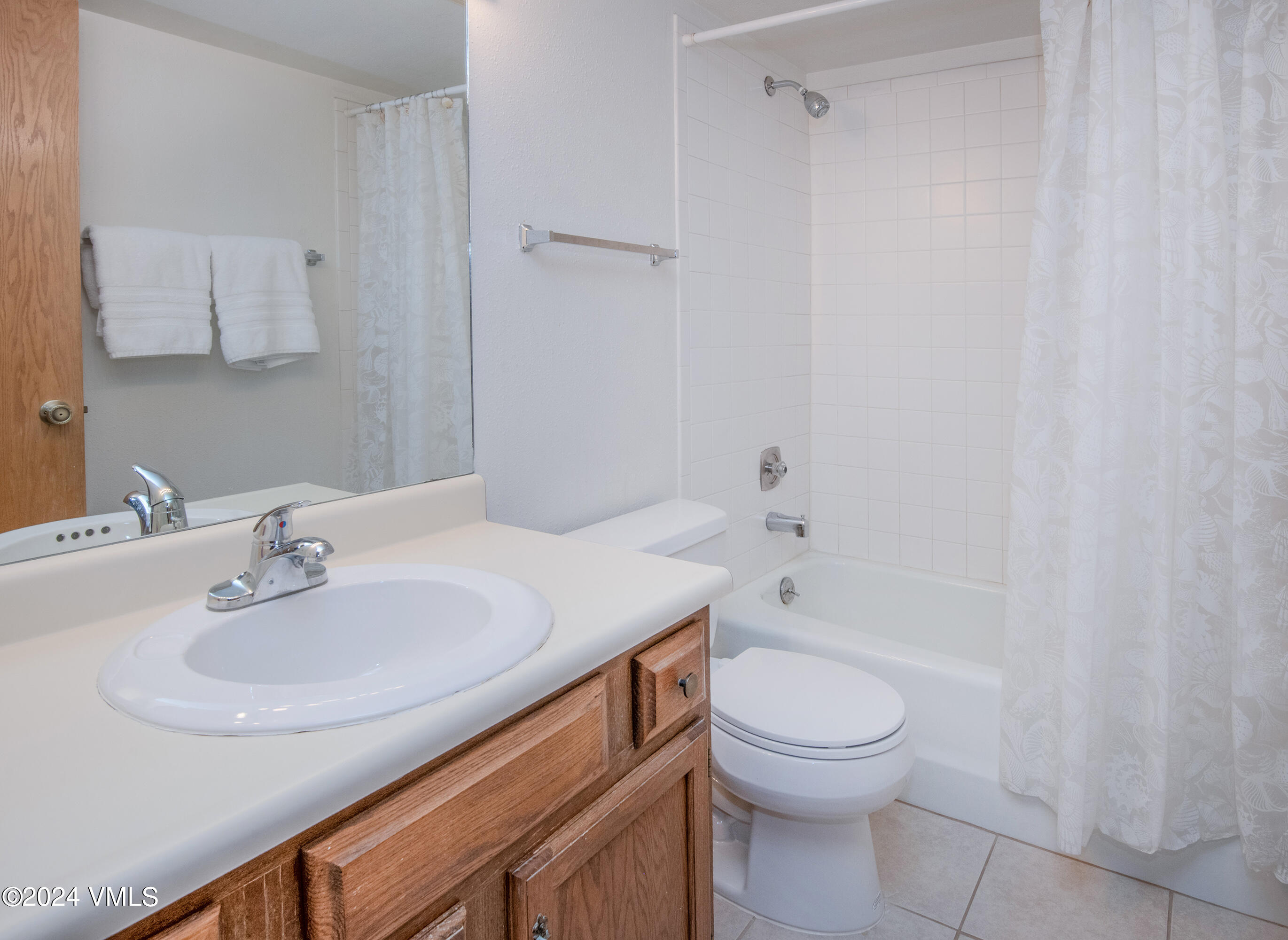 1030 Lions Ridge Loop, Unit 301 Vail, CO 81657 - Photo 20 of 28 a bathroom with a sink toilet and shower