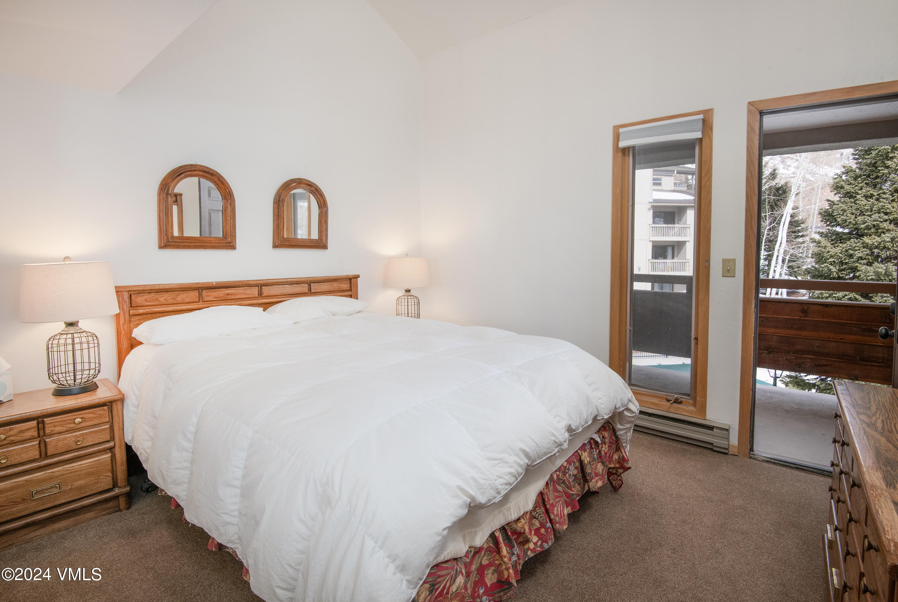 1030 Lions Ridge Loop, Unit 301 Vail, CO 81657 - Photo 21 of 28 a bedroom with a bed and a window