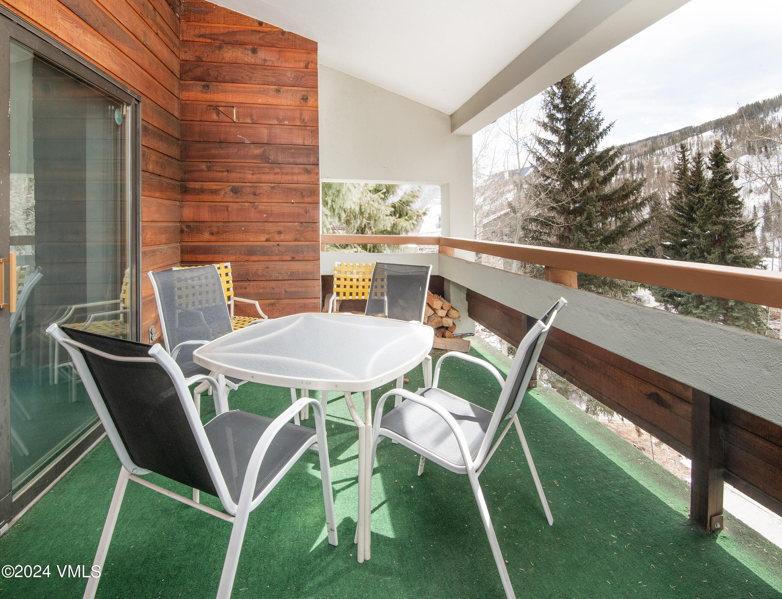 1030 Lions Ridge Loop, Unit 301 Vail, CO 81657 - Photo 23 of 28 a view of an outdoor sitting area with chairs