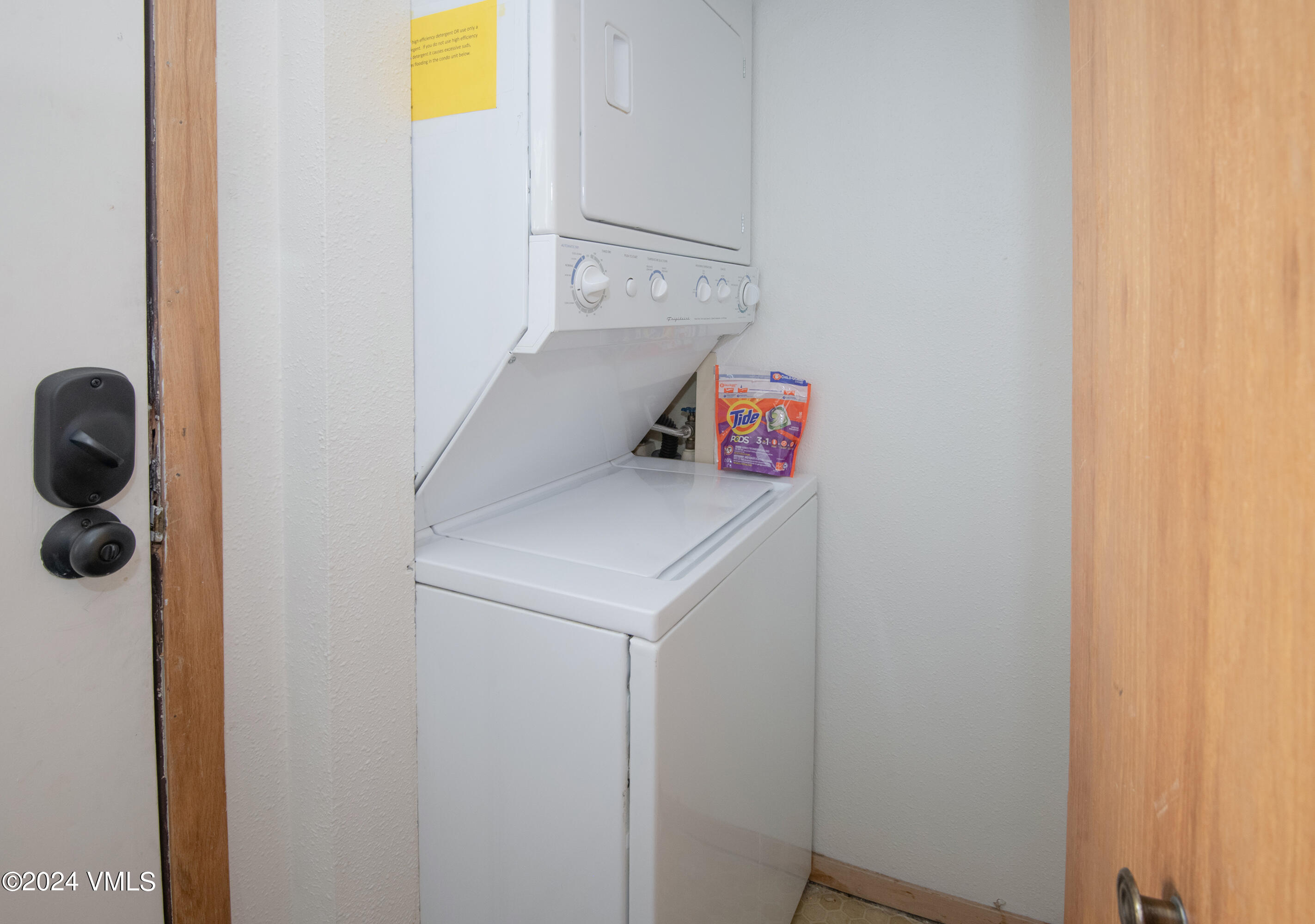 1030 Lions Ridge Loop, Unit 301 Vail, CO 81657 - Photo 25 of 28 a utility room with dryer and washer