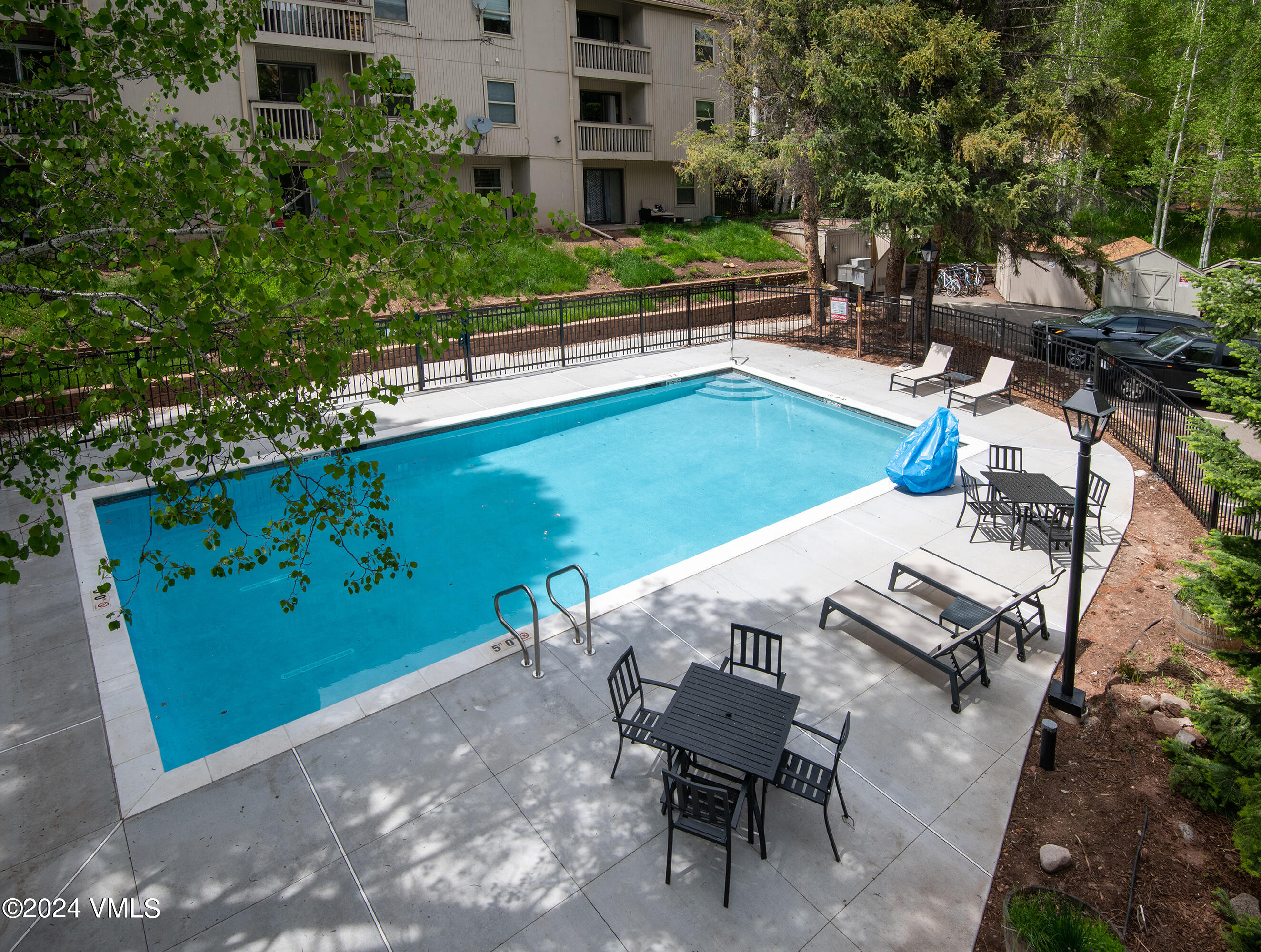1030 Lions Ridge Loop, Unit 301 Vail, CO 81657 - Photo 27 of 28 a view of a chairs and table in the patio