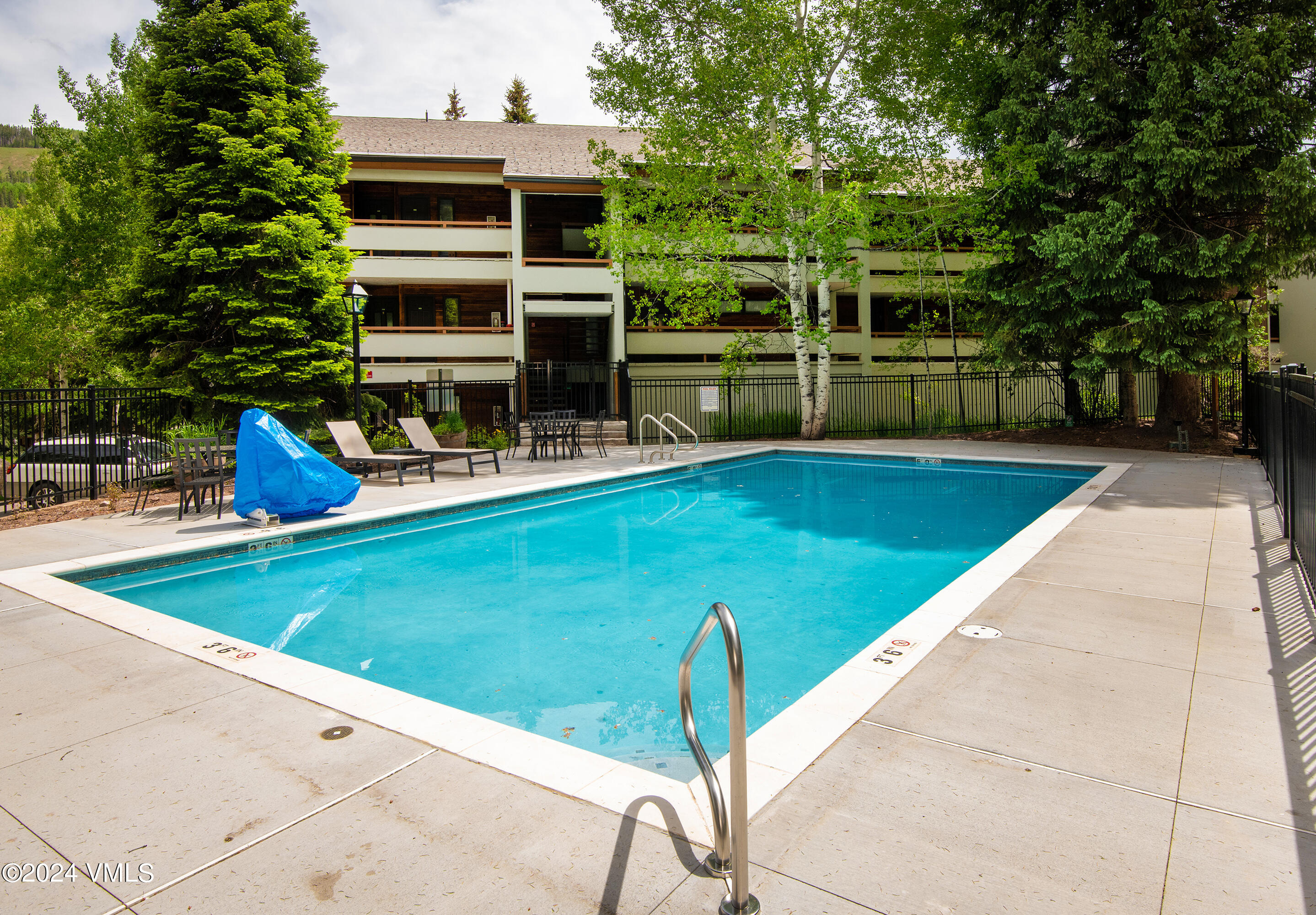 1030 Lions Ridge Loop, Unit 301 Vail, CO 81657 - Photo 28 of 28 a view of a house with pool