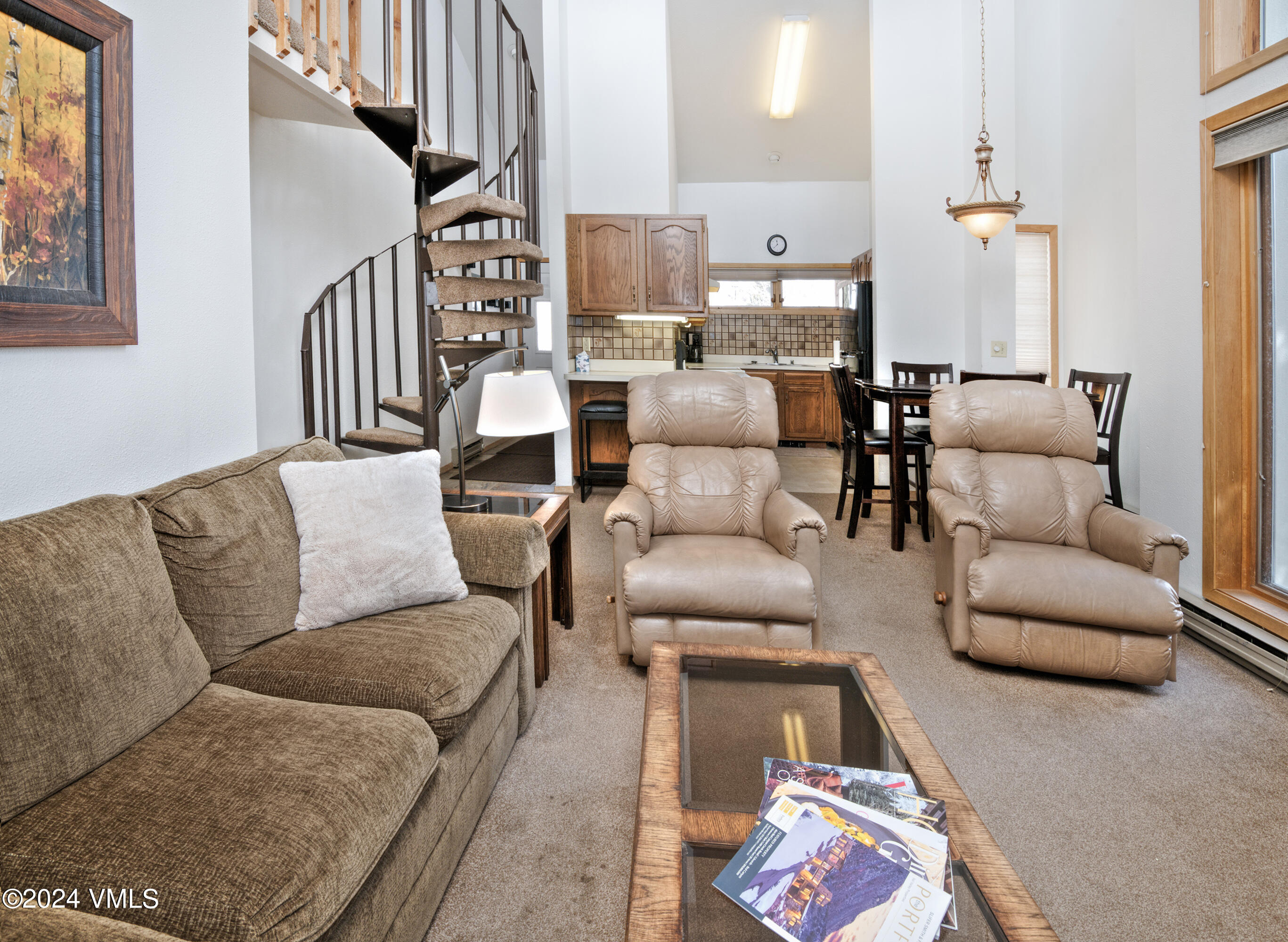 1030 Lions Ridge Loop, Unit 301 Vail, CO 81657 - Photo 7 of 28 a living room with furniture and a painting
