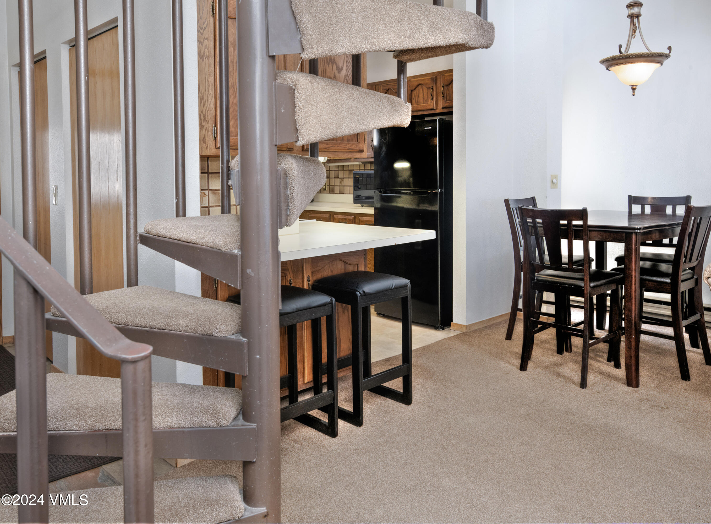1030 Lions Ridge Loop, Unit 301 Vail, CO 81657 - Photo 10 of 28 a dining room with furniture and window