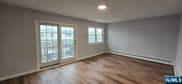141 Grant Avenue, Unit 3 East Newark, NJ 07029 - Photo 2 of 13 an empty room with wooden floor and windows