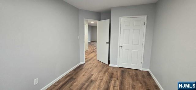 141 Grant Avenue, Unit 3 East Newark, NJ 07029 - Photo 7 of 13 a view of a hallway with wooden floor