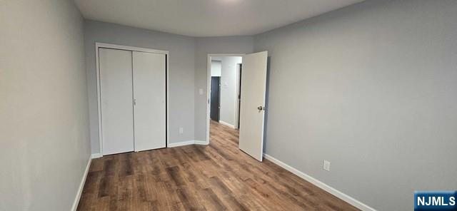 141 Grant Avenue, Unit 3 East Newark, NJ 07029 - Photo 9 of 13 a view of hallway with wooden floor