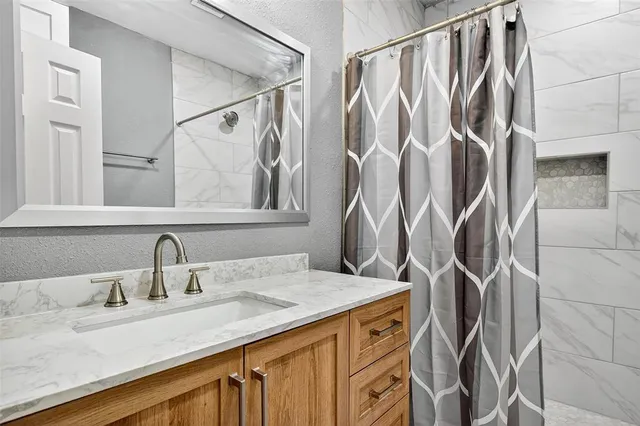 a bathroom with a sink and mirror