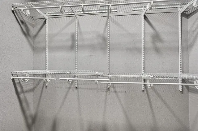 a bathroom with a shower and a glass door