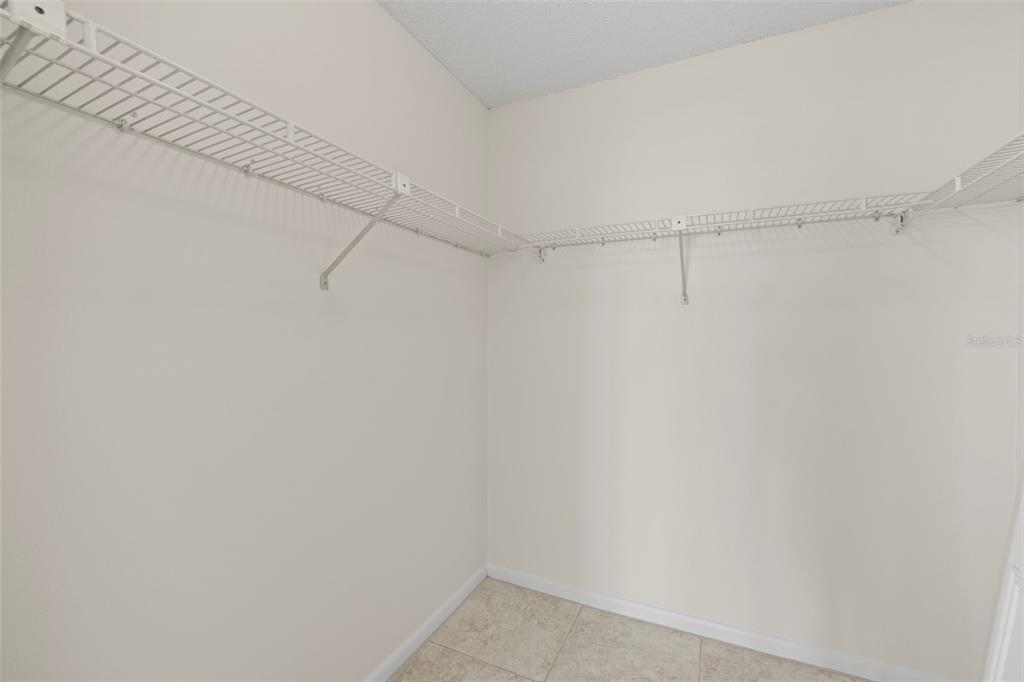 9425 Blind Pass Road, Unit 1008 St. Pete Beach, FL 33706 - Photo 30 of 65 a view of a room with racks on the wall