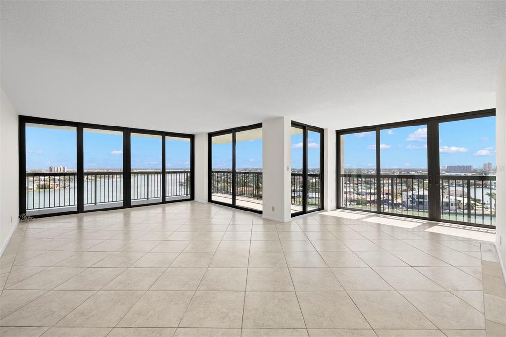 9425 Blind Pass Road, Unit 1008 St. Pete Beach, FL 33706 - Photo 3 of 65 a view of an empty room with a large window