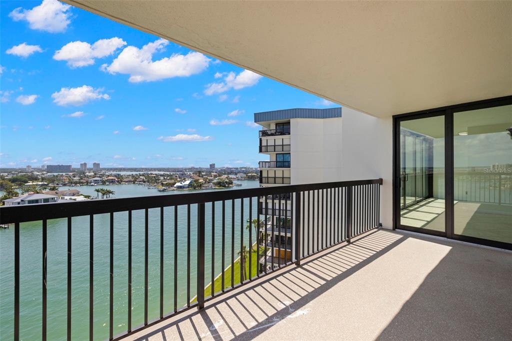 9425 Blind Pass Road, Unit 1008 St. Pete Beach, FL 33706 - Photo 34 of 65 a balcony with street view