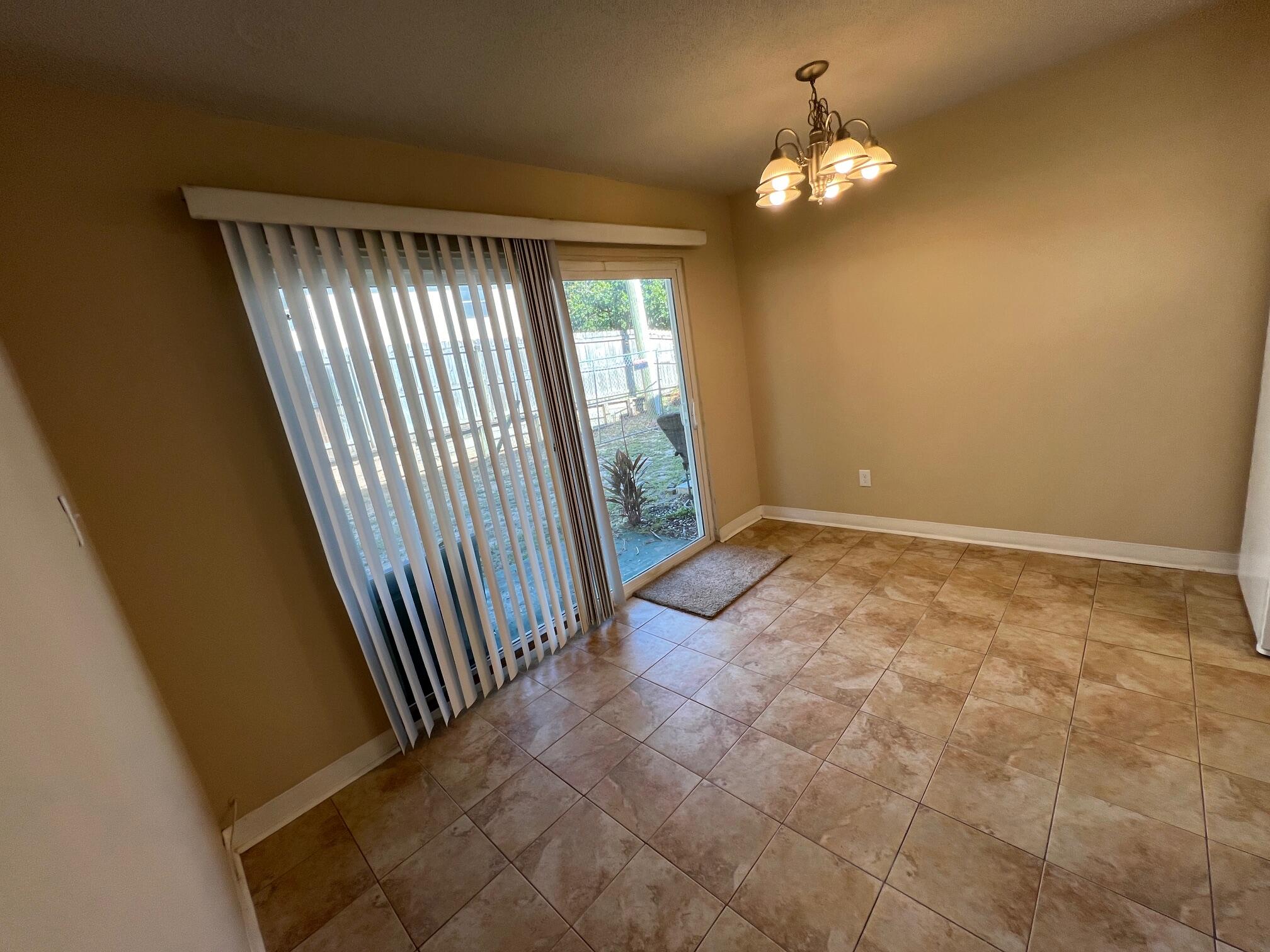210 Pelham Road, Unit 105B Fort Walton Beach, FL 32547 - Photo 12 of 41 a view of an empty room with a window