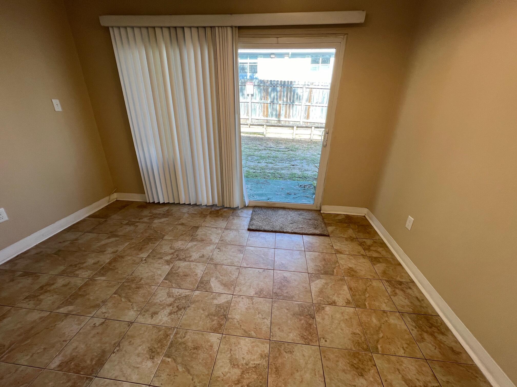210 Pelham Road, Unit 105B Fort Walton Beach, FL 32547 - Photo 16 of 41 a view of an empty room and window