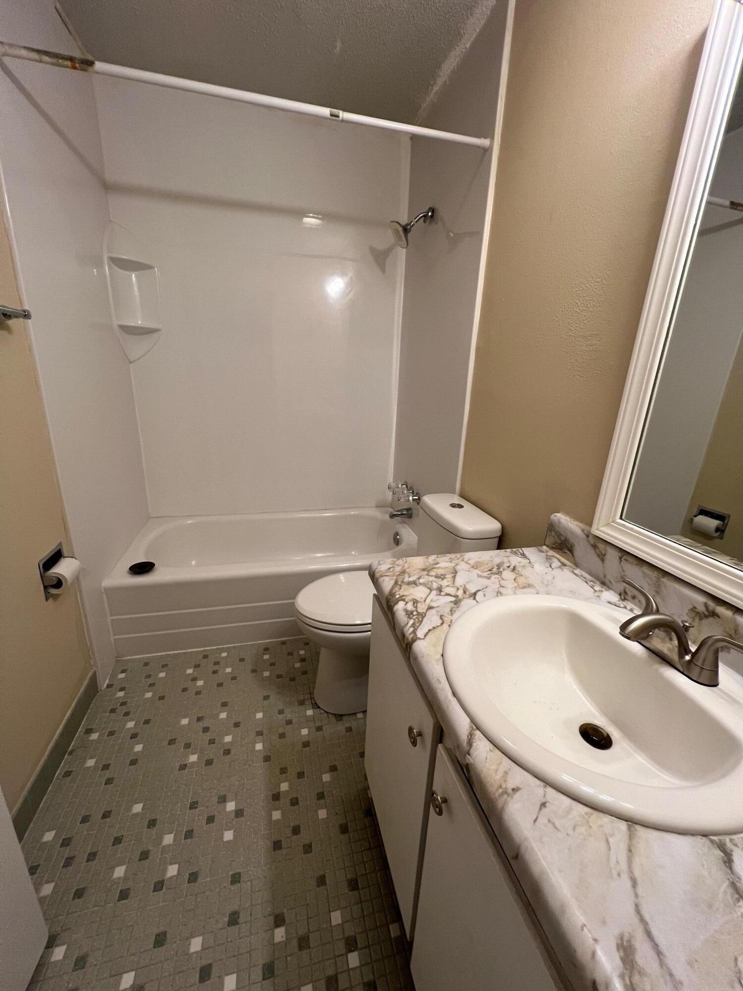 210 Pelham Road, Unit 105B Fort Walton Beach, FL 32547 - Photo 33 of 41 a bathroom with a sink and a mirror