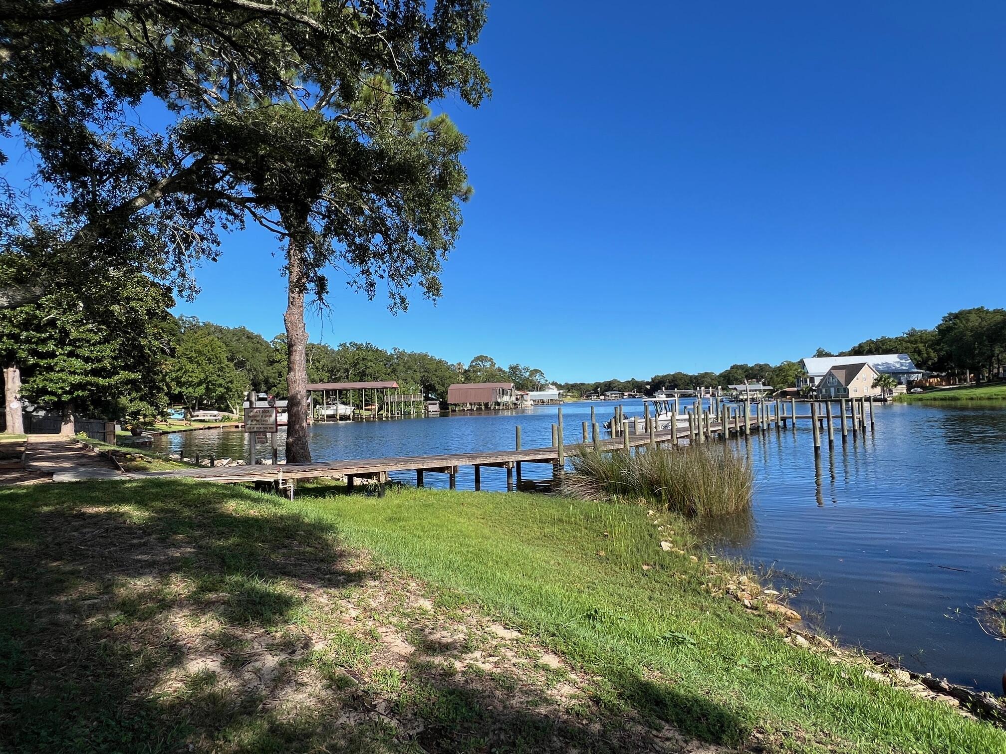 210 Pelham Road, Unit 105B Fort Walton Beach, FL 32547 - Photo 35 of 41 a view of a house with a yard